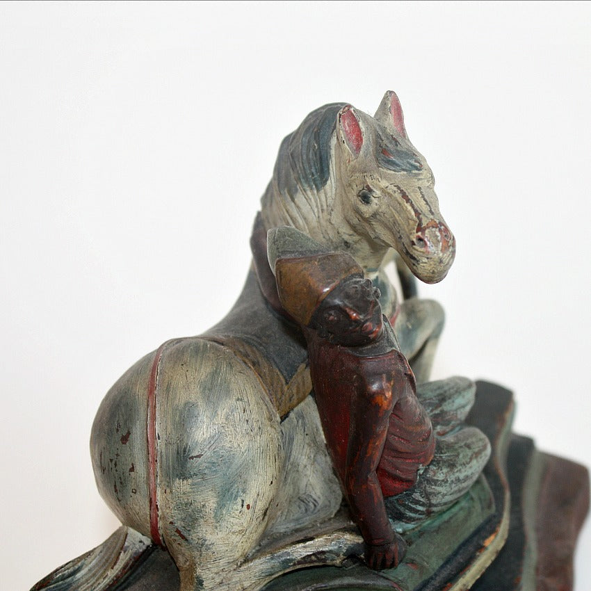 Detail antique hand carved wood rider figure showing expressive carving and original painted surface, early 20th century
