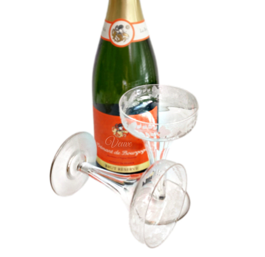 Bottle of Veuve Clicquot champagne with 19th Century, French Hollow Stem Champagne Coupes