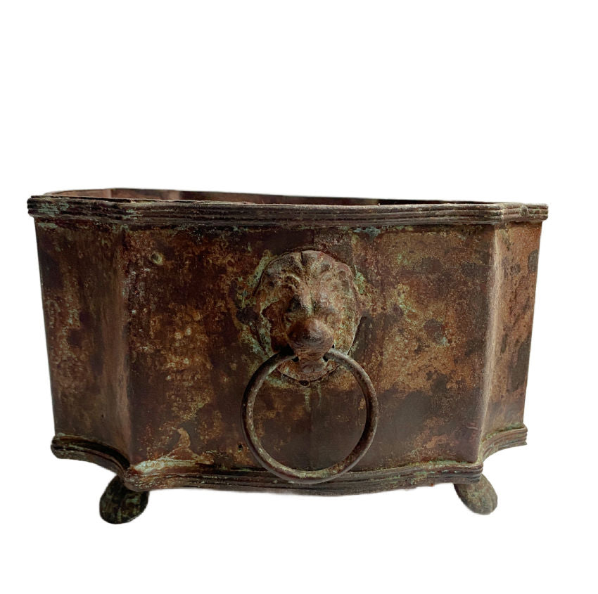 Aged metal planter, lion head handles, paw feet, rustic elegance, country decor, FrenchGardenHouse style, decorative planter, luxury interior accent, antique-inspired planter, sculptural planter, heritage décor