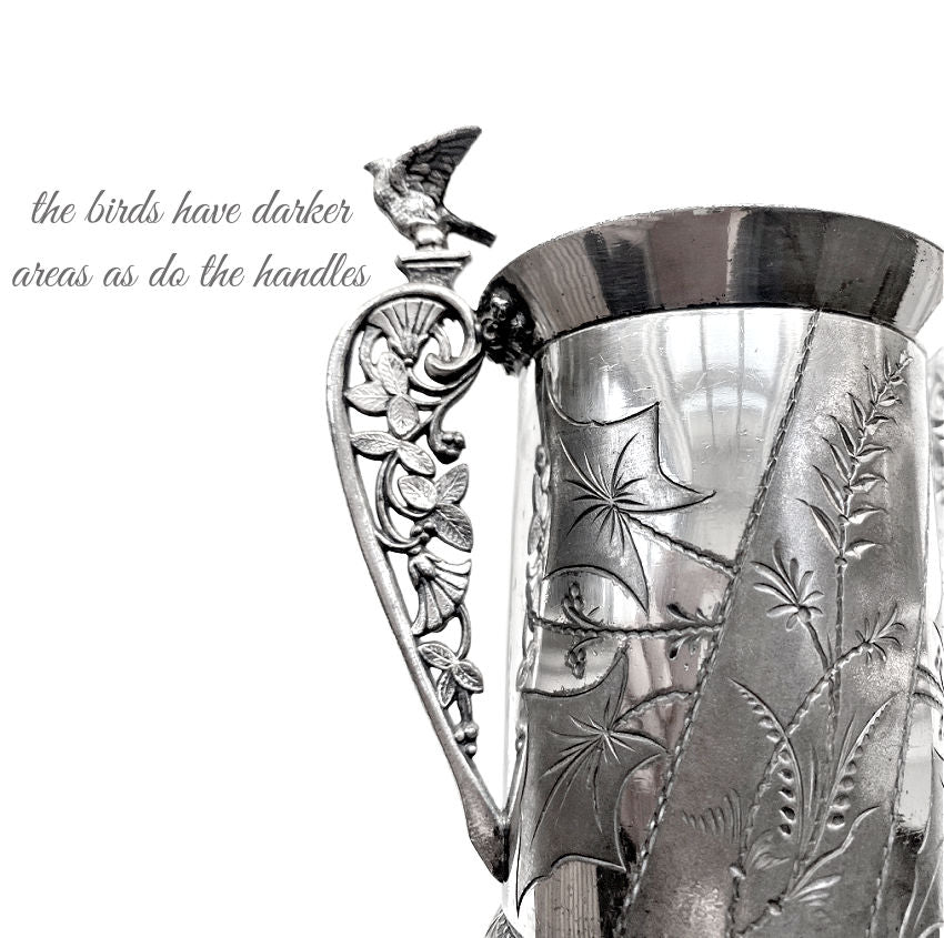 Victorian silver, antique silver plate, Aurora Silver Plate Co, antique spooner, bird motif, Victorian tableware, American antique silver, 19th century silver, decorative arts, nature inspired design, collectible silver, antique dining decor, Victorian decor, silver bird handles, French Garden House style, engraved silver, antique serving piece, silver collector, antique table accessory, botanical engraving