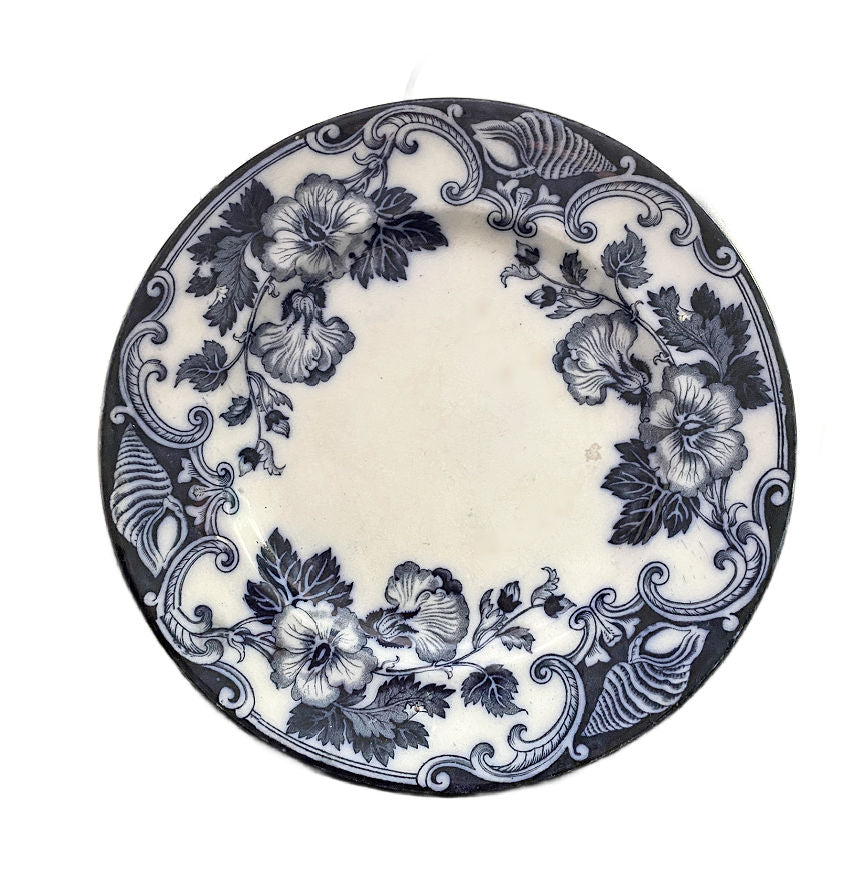 Antique 19th century Flow Blue “Althea” hibiscus floral plate by Hill Pottery, with Bellino & Fenderich Odessa mark and rich cobalt color.