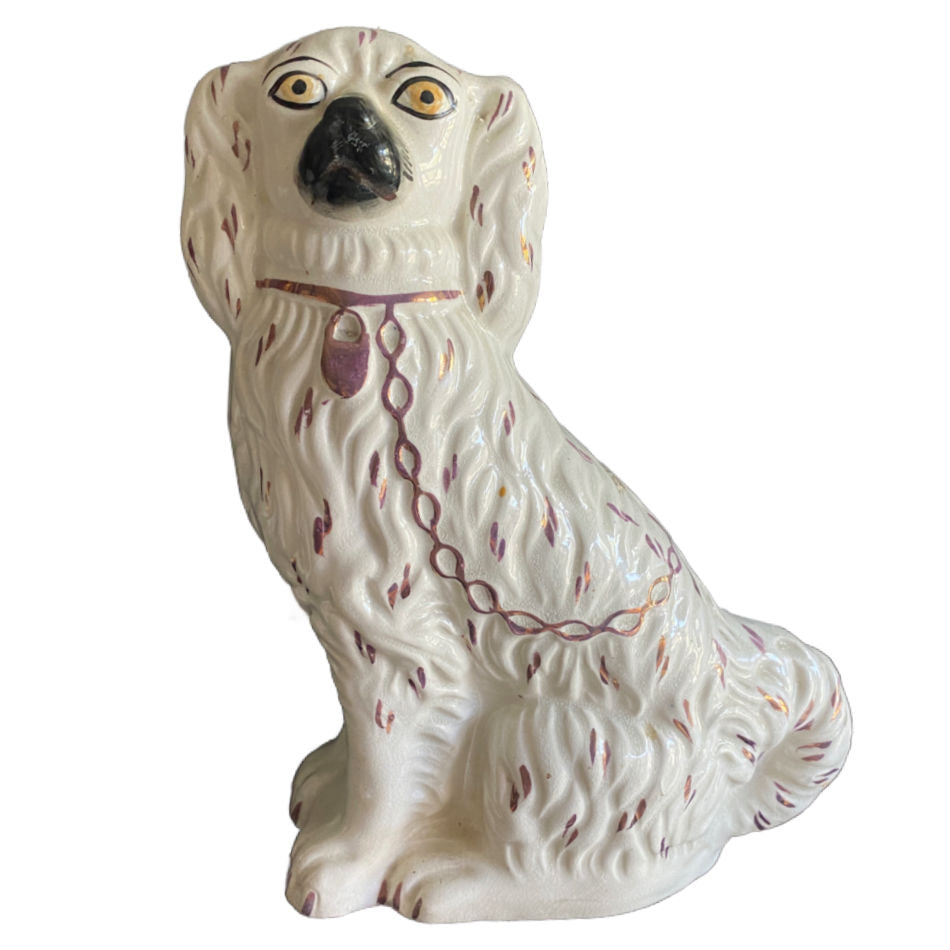 Antique Staffordshire dog with hand-painted pink lustre fur details