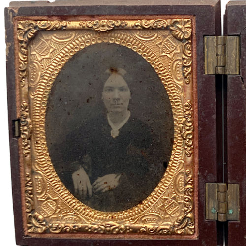 Rare Civil War era Union Case with ship’s wheel motif, retaining original portraits of a couple and elder woman. A deeply personal and historic collector’s treasure.