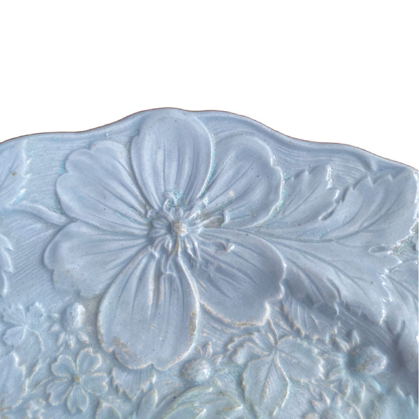 French antique porcelain flower wall plate close up texture