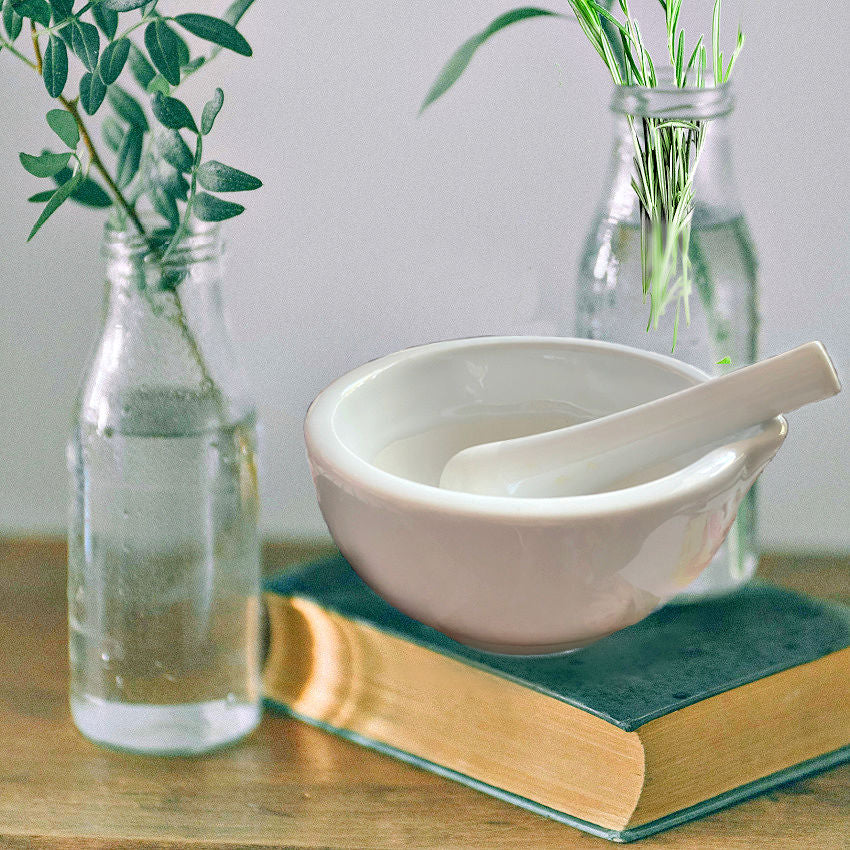 Antique French ironstone mortar and pestle displayed in rustic French Country kitchen setting
