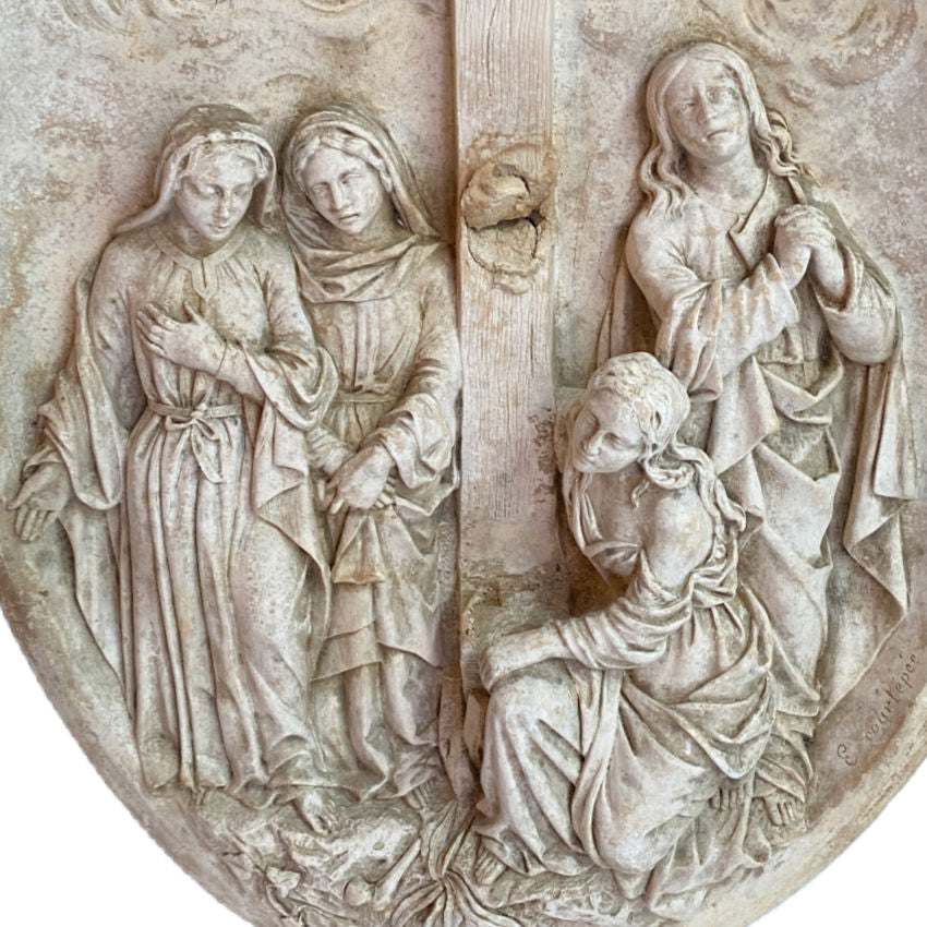 Close-up of pious women figures at foot of cross French plaster bas relief