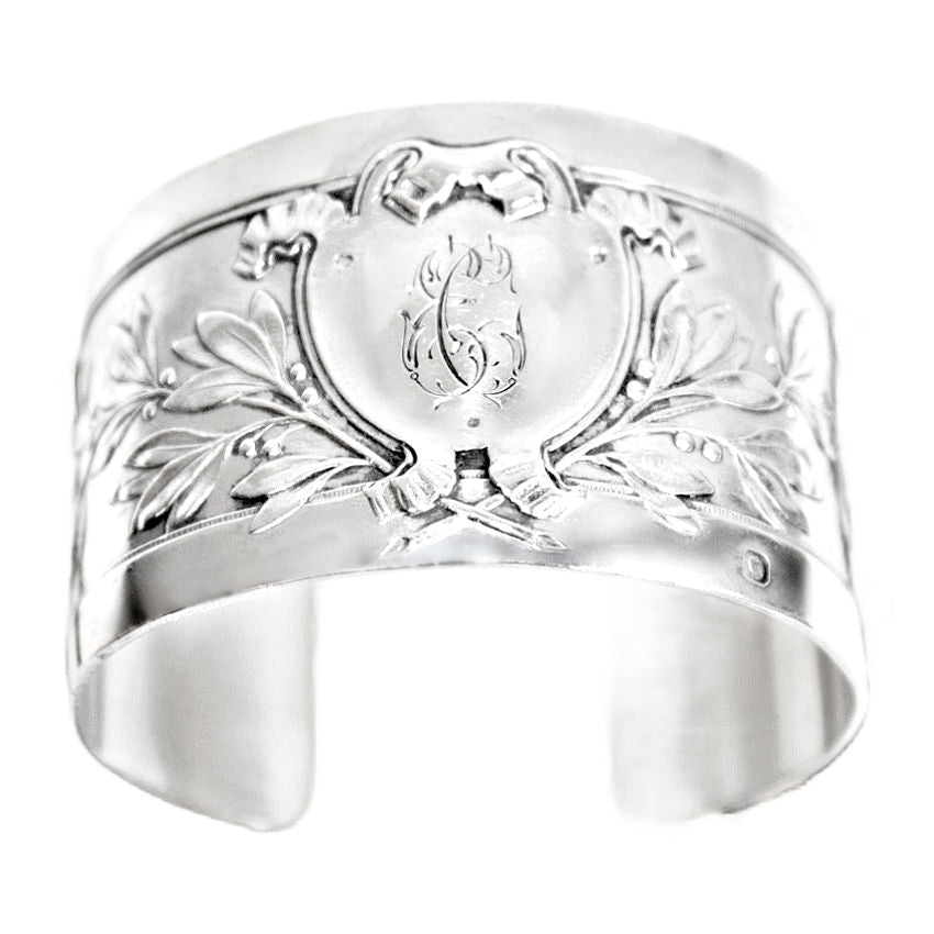 Antique French sterling silver cuff bracelet featuring an engraved heraldic shield and foliate design. Elegant, rare, and timeless.