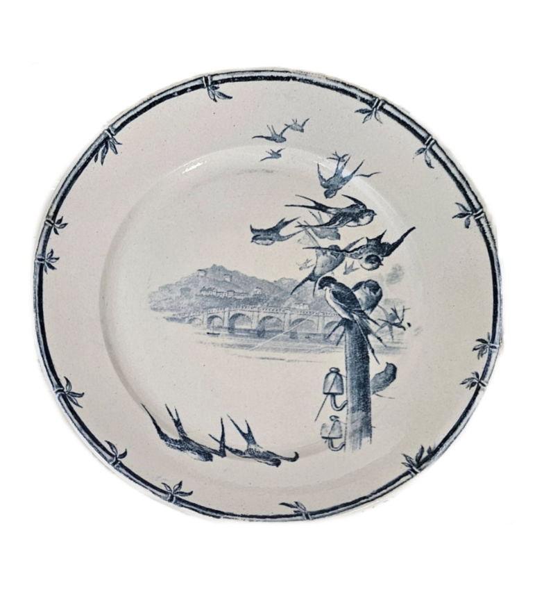 Antique Gien Faience plate in blue and white with birds and a bridge.