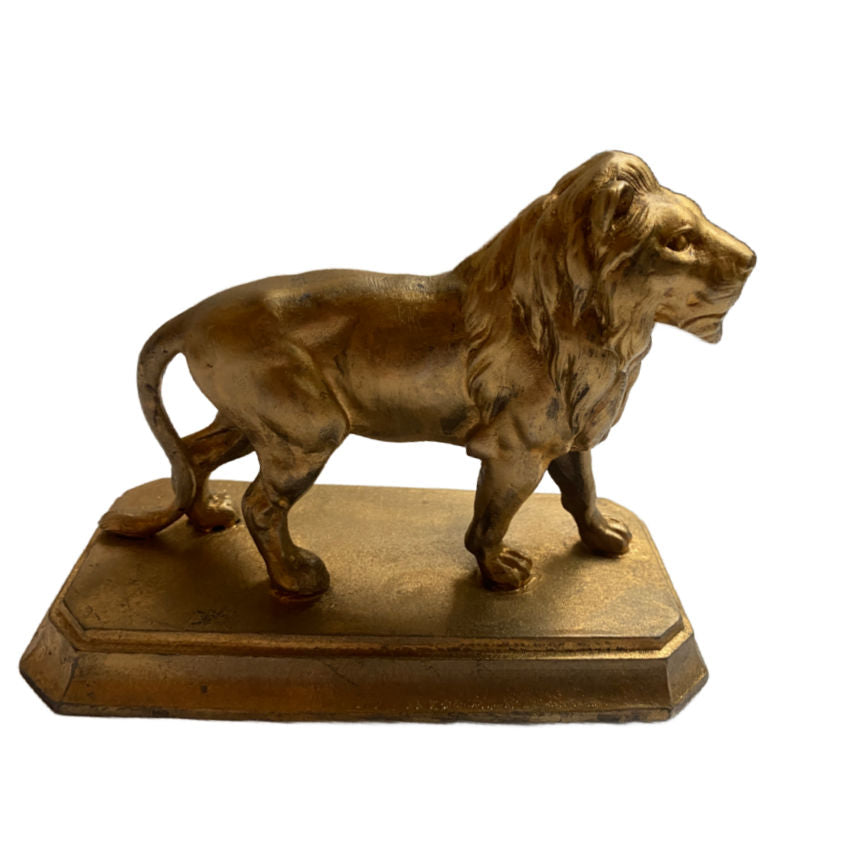 Antique gilded metal lion presse papier with rich patina and elegant detail. A classic French desk accessory adding charm and sophistication to any décor.