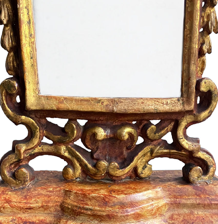 Antique decorative standing mirror with aged gold leaf and sculptural cherub design gilt rococo details