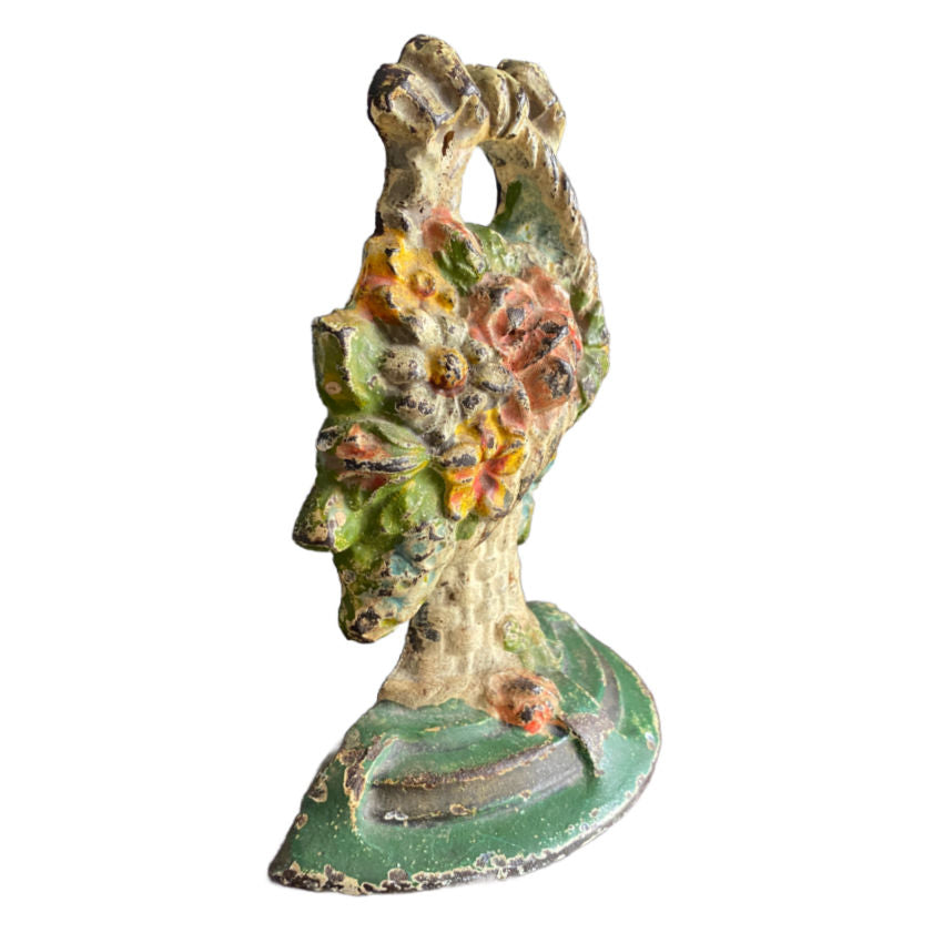 Early 20th century Hubley doorstop painted flower basket design