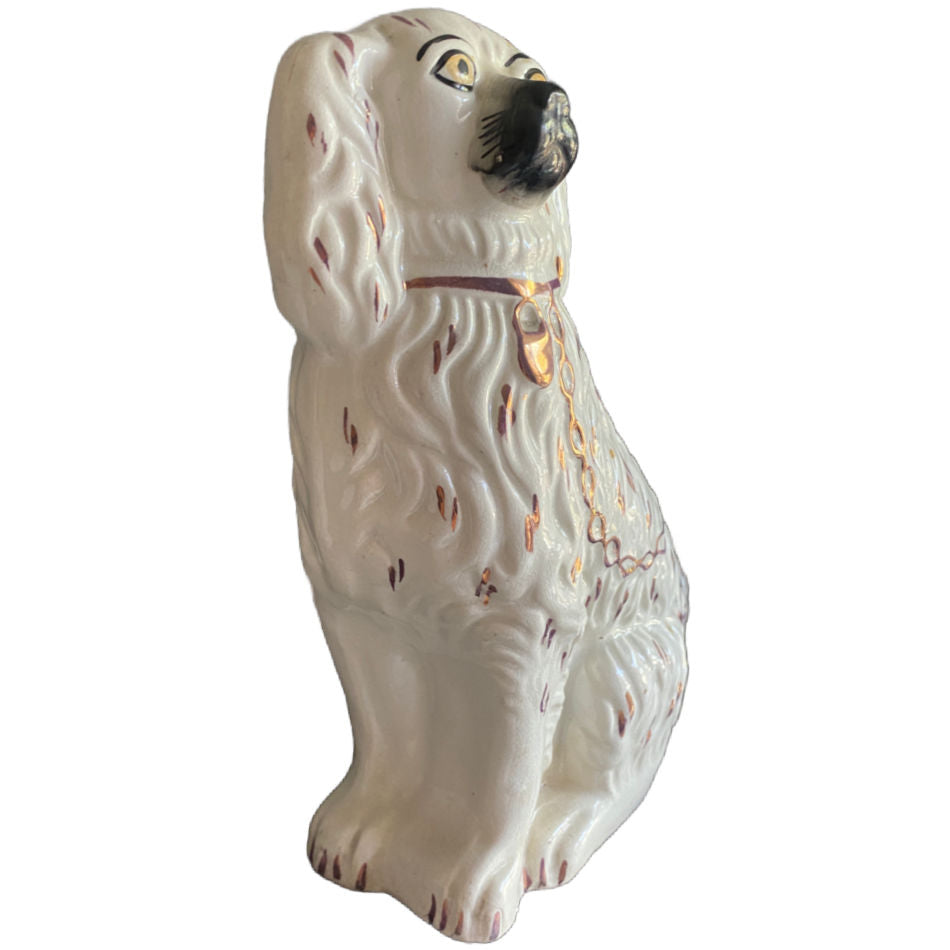 Side detail of 19th century English Staffordshire dog with pink lustre collar and chain