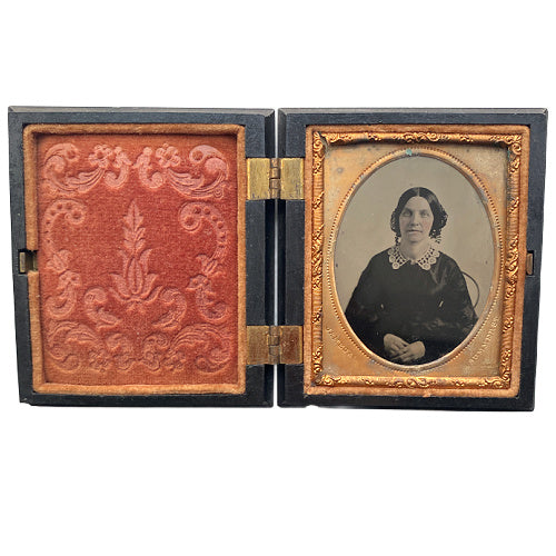 Antique Union case with elegant scrolled pattern, signed James & Co, featuring a single 19th-century woman portrait inside. Collectible photographic case.