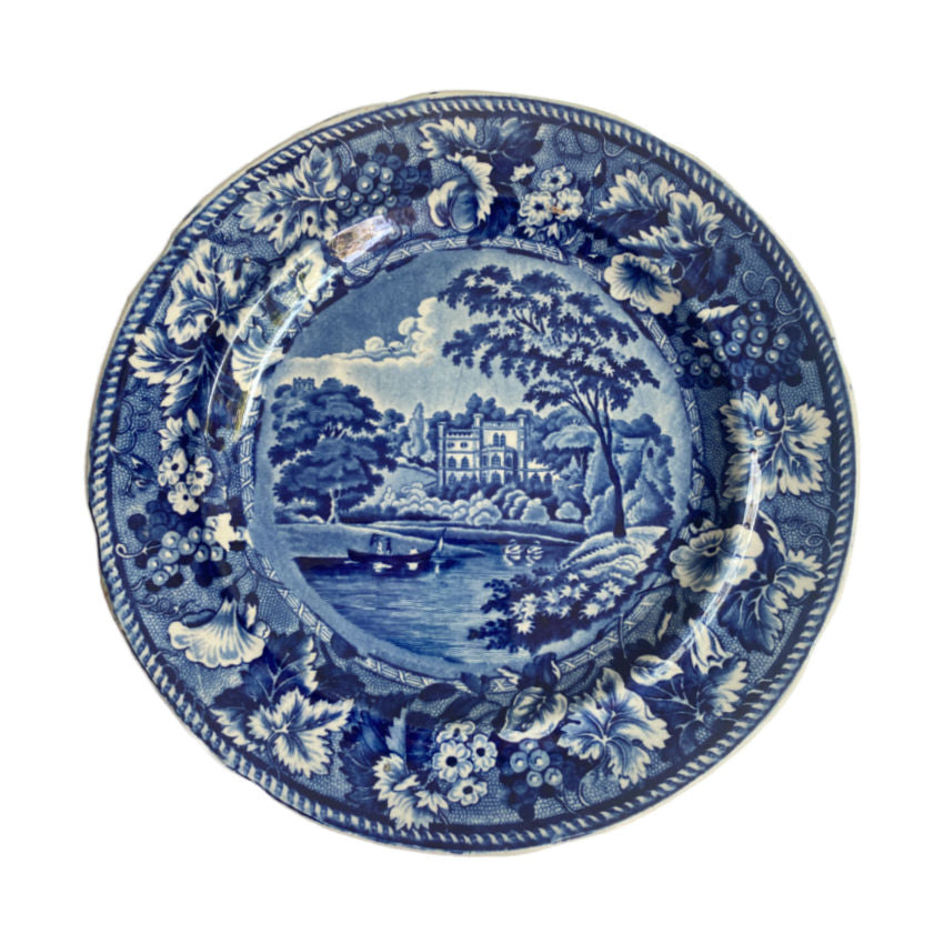 Antique Staffordshire historical blue and white decorative plate with landscape design on a white background