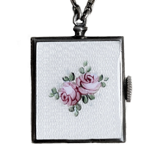 Edwardian sterling silver watch pin with white guilloché enamel, hand-painted roses and bow motif, a refined early 20th century jewel.