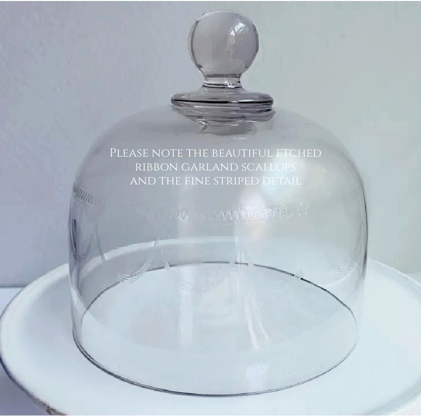 Close-up of hand-engraved scalloped pattern on antique French glass cloche