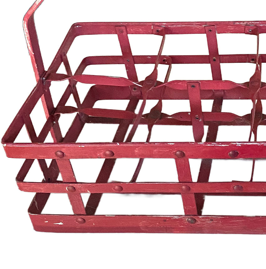 European wine cellar rack red painted iron bottle holder rustic decorative storage close up view