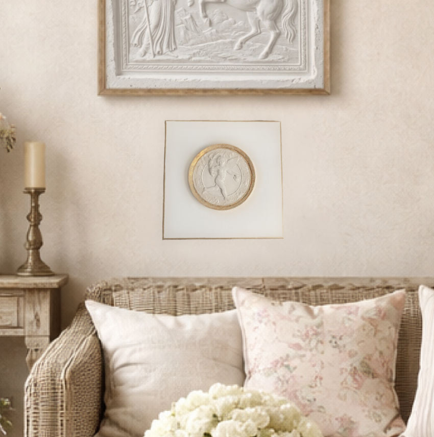 Grand Tour inspired cherub relief on circular canvas, gilt edged classical wall study for curated interiors in living room