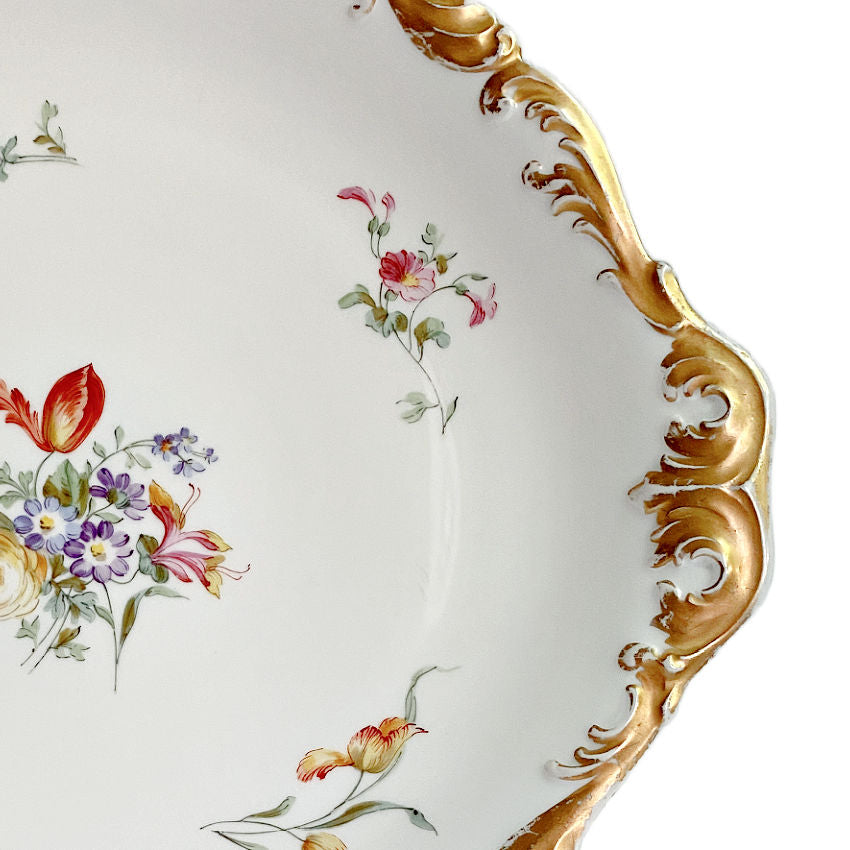 Gilt rim of scalloped Limoges tray.