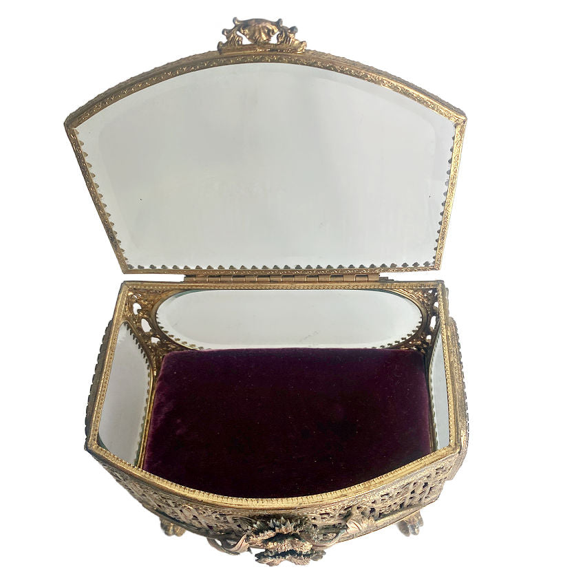 Ornate gilt filigree jewelry casket with beveled glass lid and deep pink silk velvet lining. A romantic statement piece for dressing table display-open