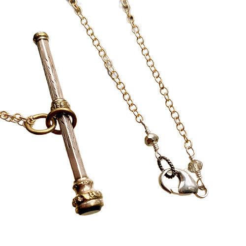 Antique gold chatelaine pencil necklace with red garnet. A rare 19th-century writing accessory worn as jewelry, rich in history.