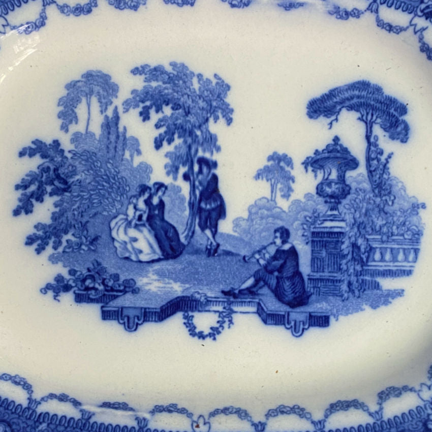 Early 1900s English flow blue platter, pastoral scene inspired by Jean-Antoine Watteau, collectible antique.