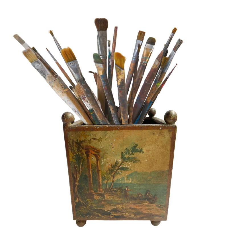 19th Century French tôle peinte petit jardinière with hand-painted pastoral scene and original patina. Elegant square form on ball feet, perfect for décor. with artist paint brushes