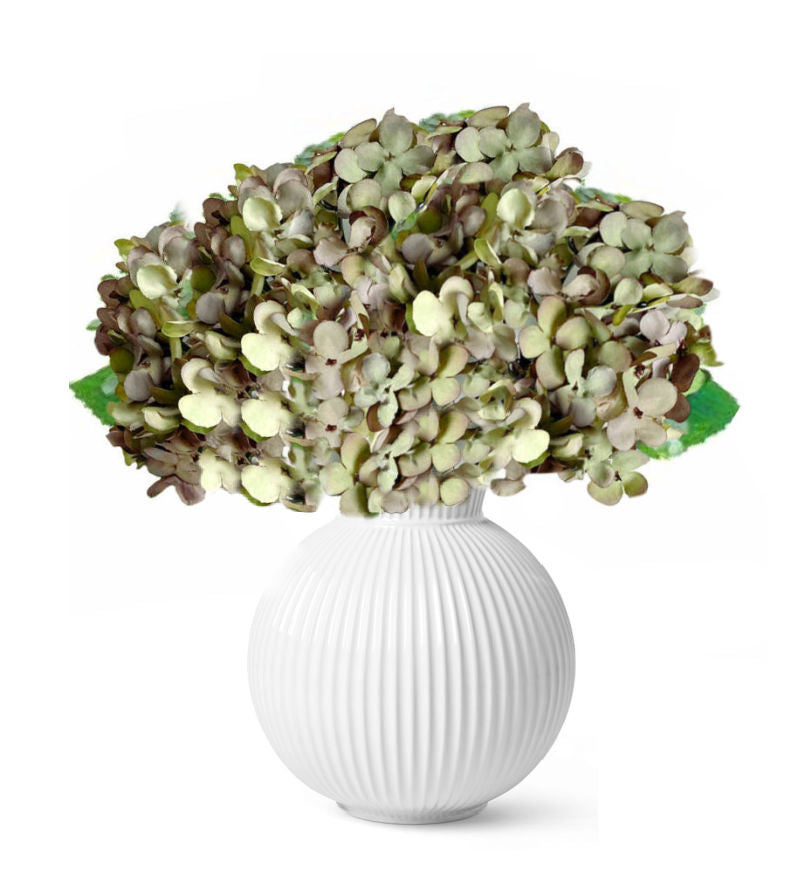 Realistic faux hydrangeas in white vase