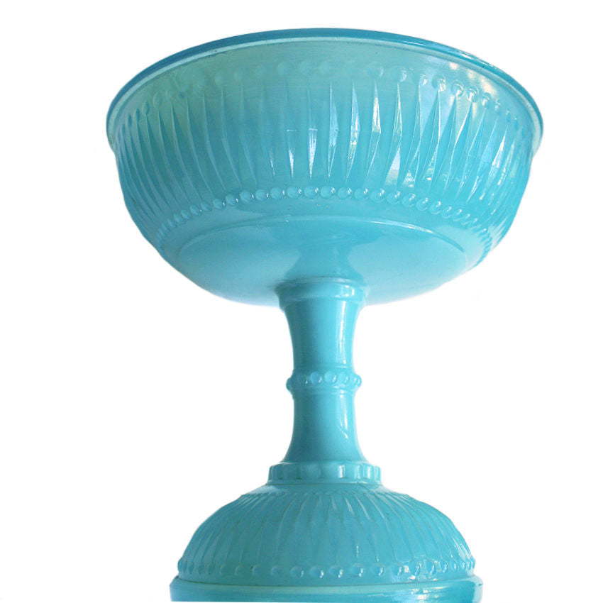 Close view of antique opaline glass centerpiece bowl showing soft translucent glow