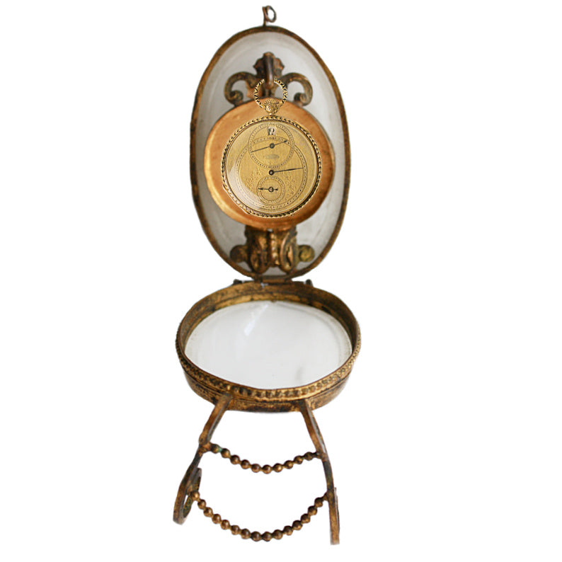 Antique French Palais Royal Opaline Glass Egg Pocket Watch Stand with a gilt bronze stand and curving feet.