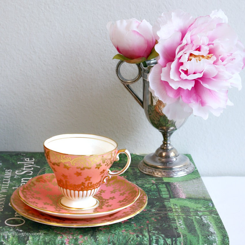 Antique pink and gold teacup trio