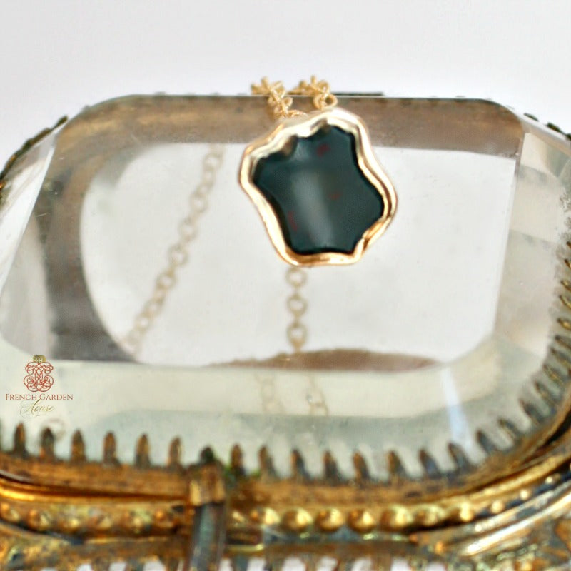 19th century lady’s wax seal necklace featuring a heliotrope shield fob. Elegant antique jewelry with rich symbolism and heirloom appeal.