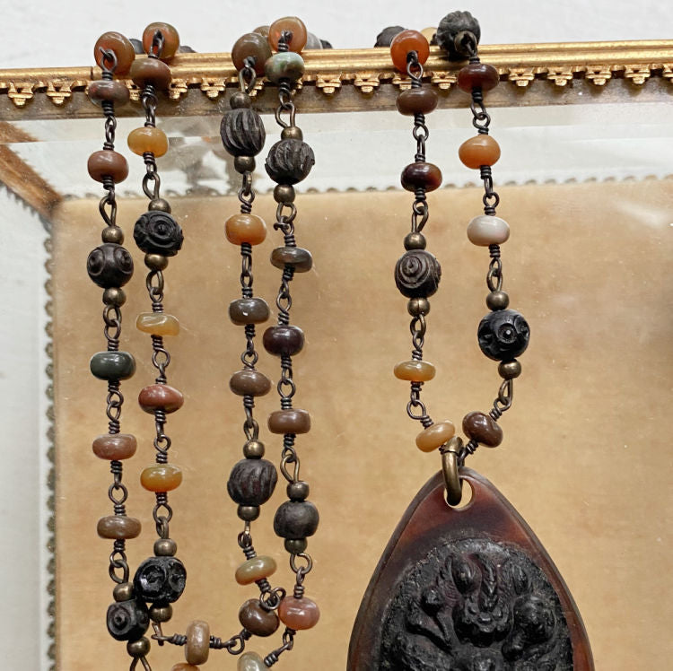 Antique Victorian gutta percha pendant on a tonal semi-precious beaded chain, 19th century, rare collectible jewelry, exquisite craftsmanship, collector’s piece.