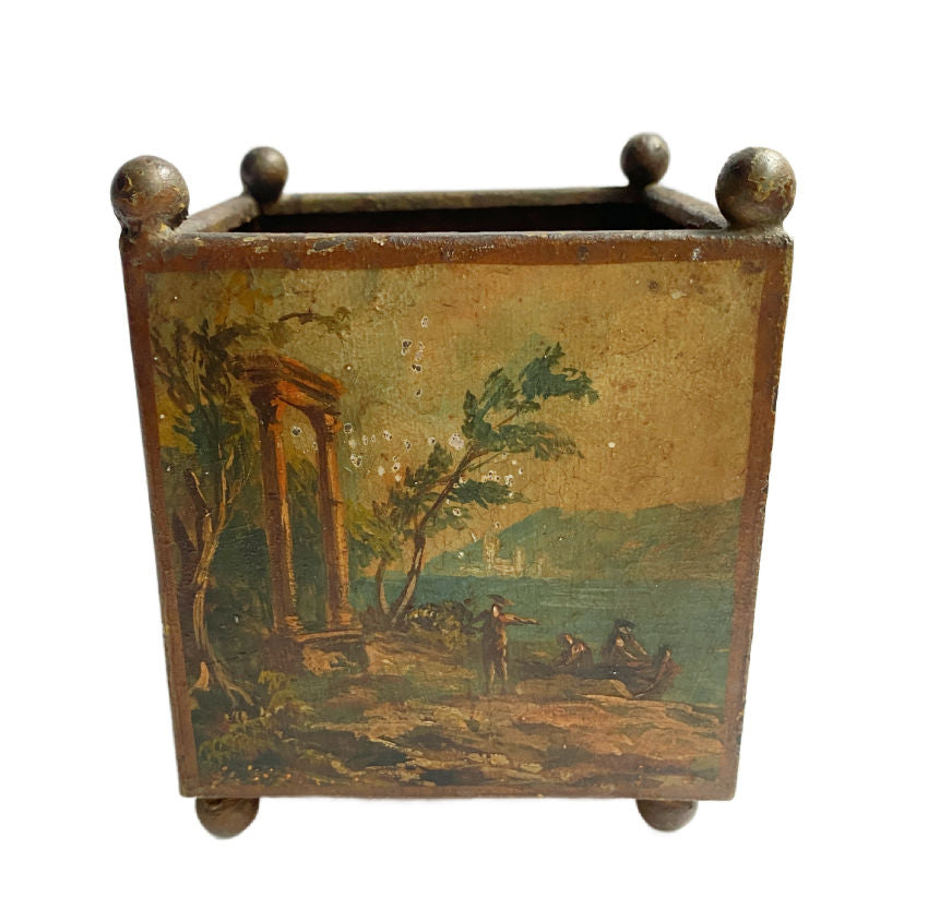 19th Century French tôle peinte petit jardinière with hand-painted pastoral scene and original patina. Elegant square form on ball feet, perfect for décor.