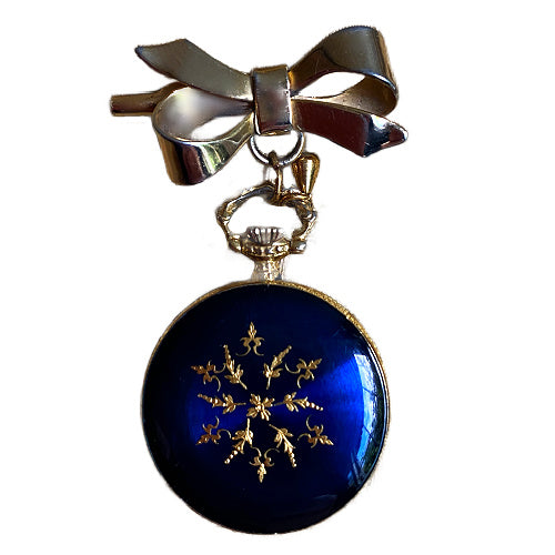 Cobalt blue enamel bow pin watch with Liga movement, a refined decorative jewel for your collection.