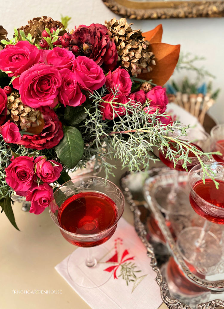 Holiday Floral arrangement in antique silver with festive cocktail how to and recipe