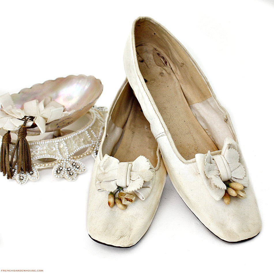 Rare circa 1850 Antique French white kid leather wedding shoes adorned with delicate wax flowers. Exquisite mid-19th century bridal footwear.