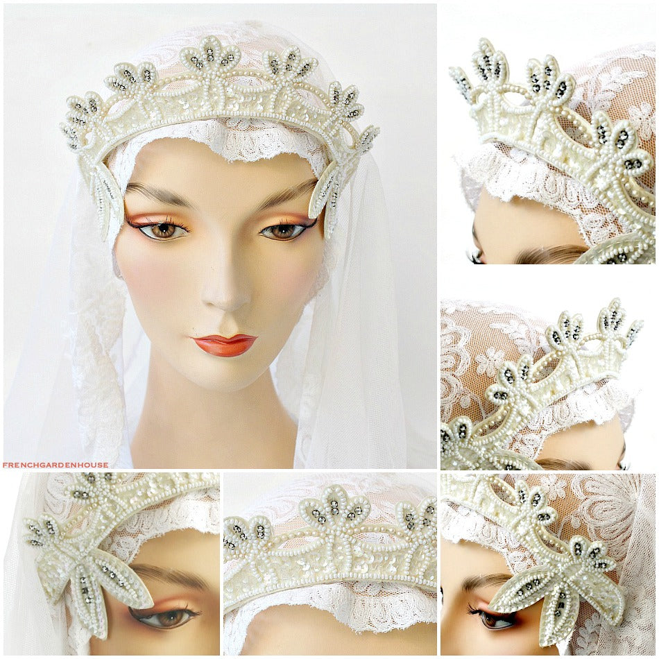 A vintage beaded and rhinestone tiara headpiece with white seed beads, pearls, and glittering paillettes, displayed on a mannequin head wearing a white veil.