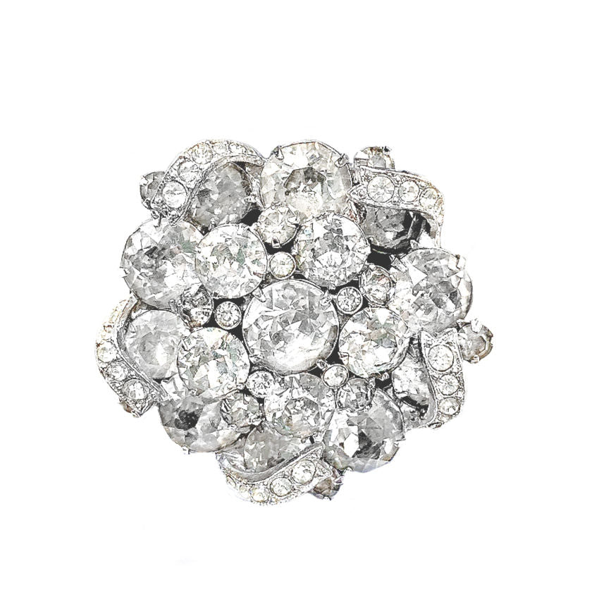 Signed 1940s Eisenberg pavé icing ribbon brooch with brilliant rhinestones in rhodium plating. Iconic vintage statement jewelry, highly collectible design.
