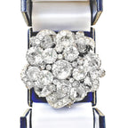 Signed 1940s Eisenberg pavé icing ribbon brooch with brilliant rhinestones in rhodium plating. Iconic vintage statement jewelry, highly collectible design.