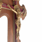 Side view detail of finely cast bronze Corpus of Christ on antique French crucifix, showing sculptural modeling and aged patina