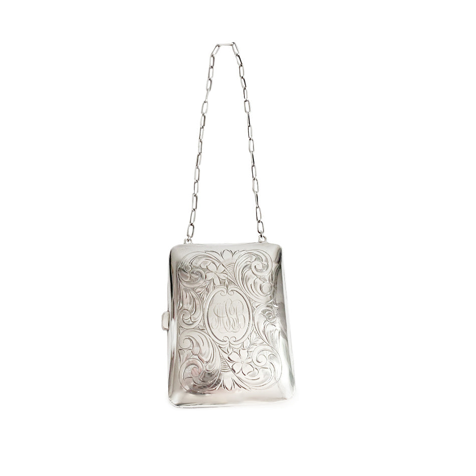 Antique sterling silver ladies&#39; evening purse compact with a floral design on the front, a leather pouch, and a chain and original powder puff.