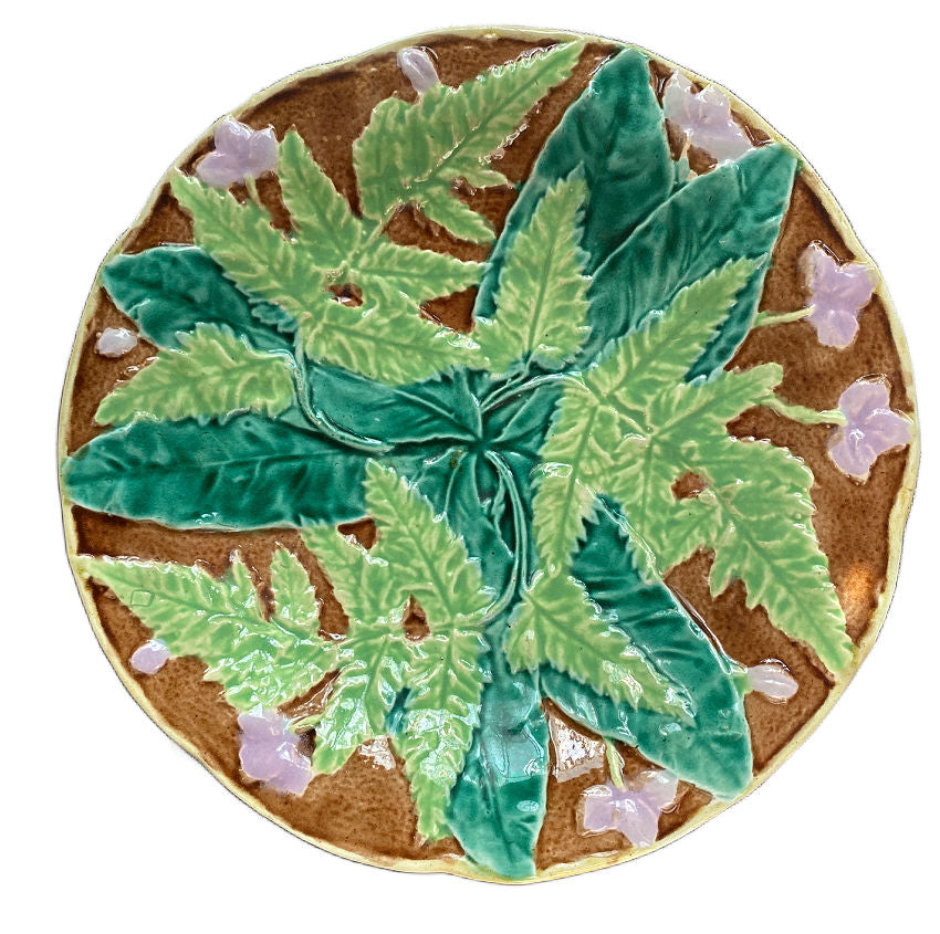 19th-century French Majolica plate with raised ferns and lavender flowers, lush glazes in green and brown, likely Sarreguemines or Orchies.