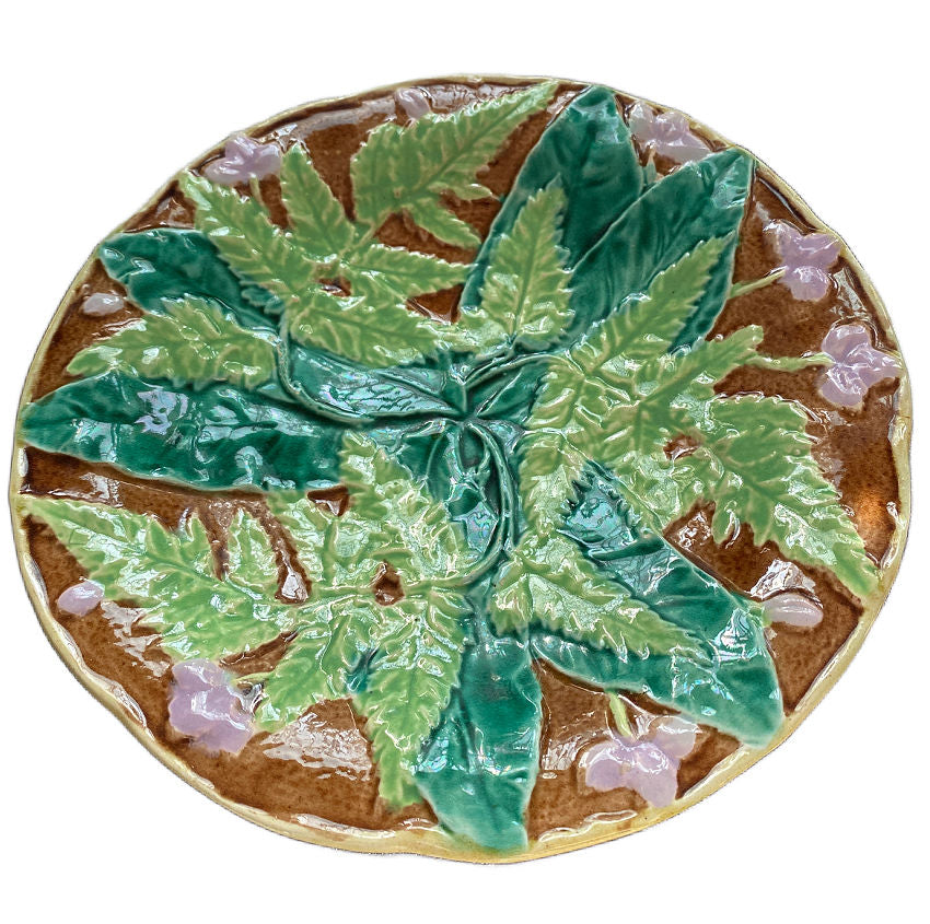 19th-century French Majolica plate with raised ferns and lavender flowers, lush glazes in green and brown, likely Sarreguemines or Orchies.