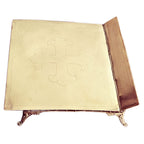 Close-up of the engraved cross top of an antique French Bible stand