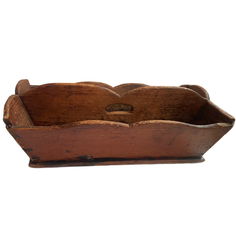 A delightful Early 19th Century Country Kitchen Work Box, made of richly aged wood with gracefully scalloped sides and a center carrying handle.
