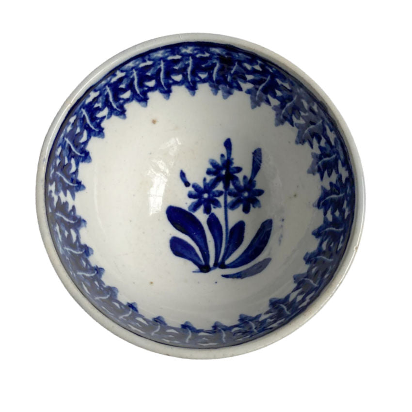 antique Petrus Regout footed Flow Blue bowl with feathered and floral decoration inside view