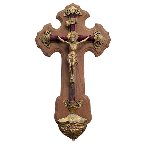 Antique French bronze crucifix with gilded holy water font on red velvet cross