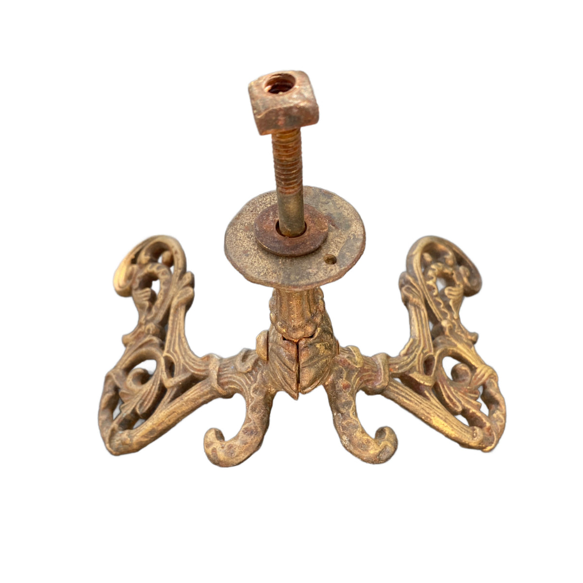 French chateau-style gilded iron wall hook with two scrolling arms and intricate 19th-century casting for luxury home decor. top view screw detail