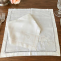 19th century French hand embroidered linen napkins styled on an elegant table